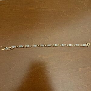 vintage two tone gold vermeil tennis bracelet with x design and oval blue stones